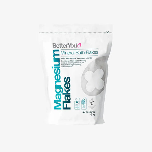 BetterYou Magnesium Flakes in a container, showing the white flaky magnesium mineral product for bath and skin use.