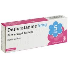 Desloratadine 5mg allergy relief tablets in blister pack from Cured Pharmacy, showing the medication packaging.