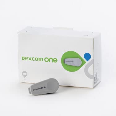 Dexcom OneTransmitter for continuous glucose monitoring, compact device with digital display and connection ports.
