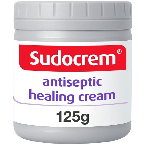Sudocrem antiseptic healing cream jar with lid, featuring a white and green label on a plain background