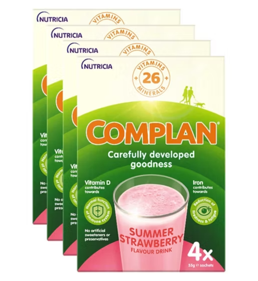 CuredPharmacy Complan Strawberry Flavour Nutritional Drink in a glass, showcasing the creamy pink beverage with strawberries.