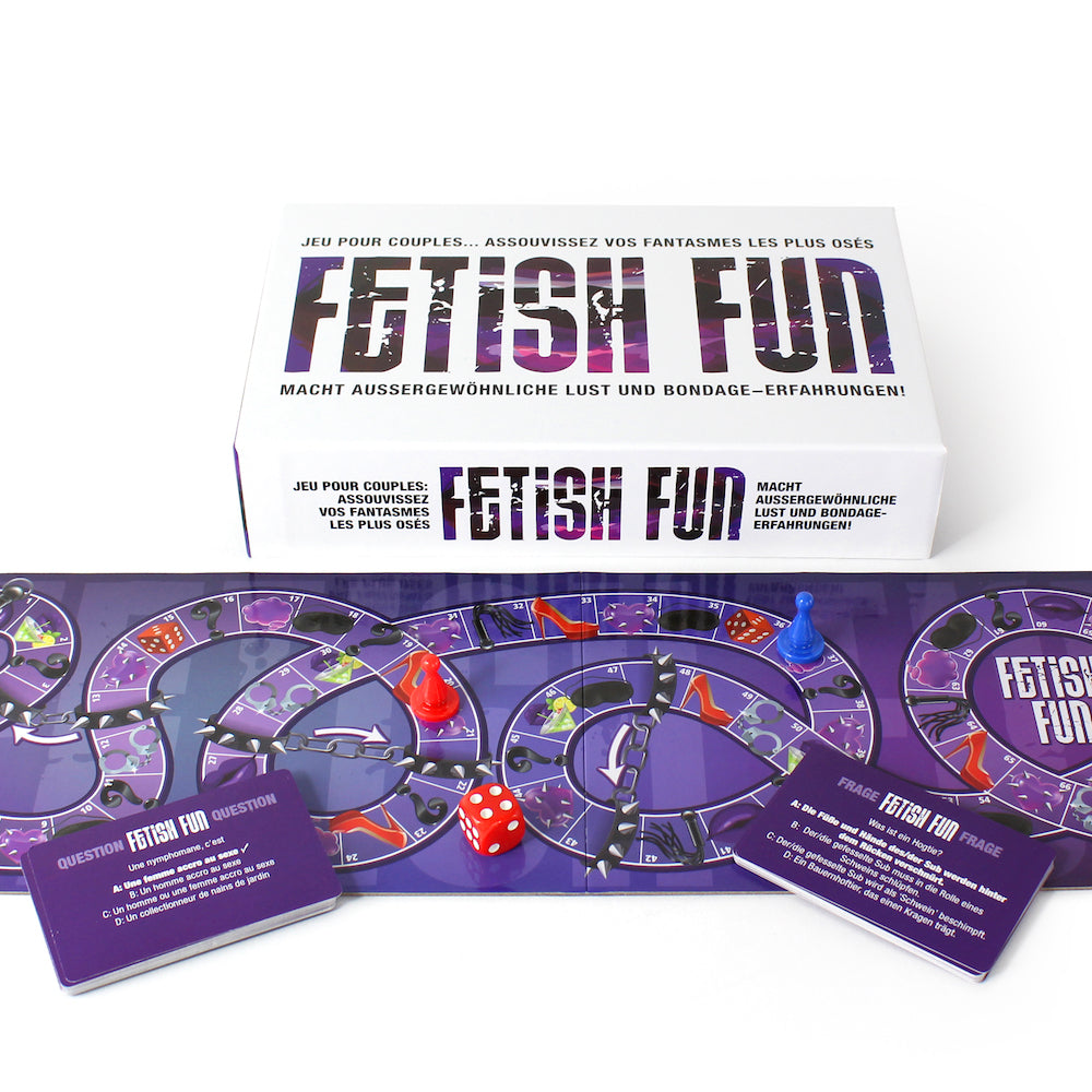 Fetish Fun Game by Creative Conceptions LTD featuring French and German language options, with game components on a table.