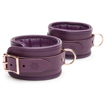 Fifty Shades Freed Cherished Collection leather ankle cuffs with metal hardware, adjustable strap, and black leather design.