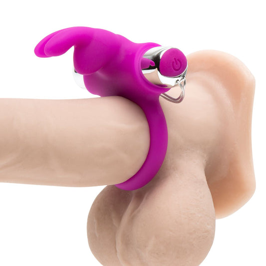 Happy Rabbit remote control ring in black, featuring buttons and adjustable strap for discreet remote operation.