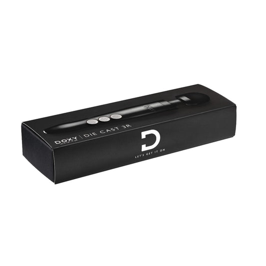 Doxy Die Cast 3 Rechargeable vibrator in matte black with packaging, showcasing sleek design and sturdy metal construction.