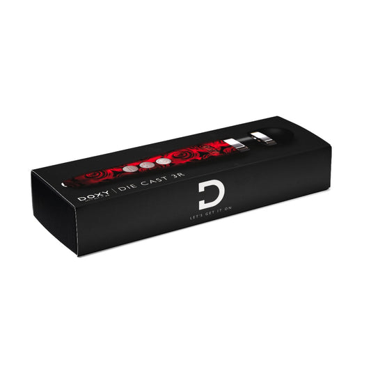 Doxy Die Cast 3 Rechargeable vibrator in roses design, showcasing its sleek, metallic finish and ergonomic shape for pleasure.