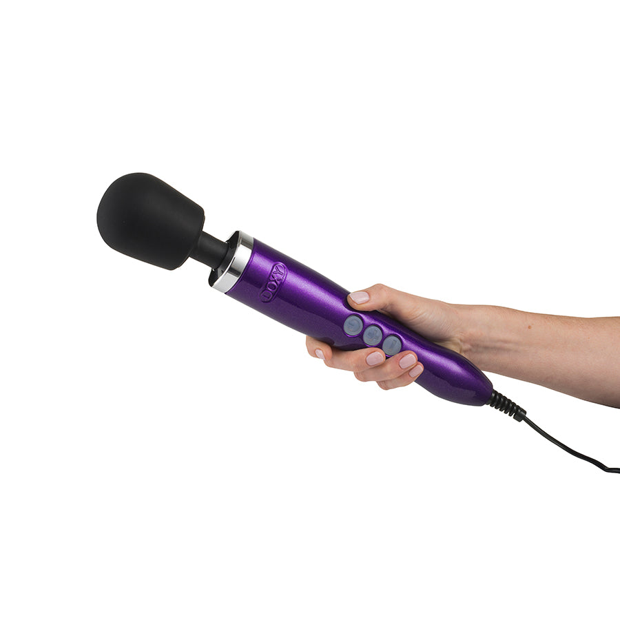 Doxy Die Cast purple vibrator with metallic finish and detailed design, showcasing its sleek shape and textured surface.