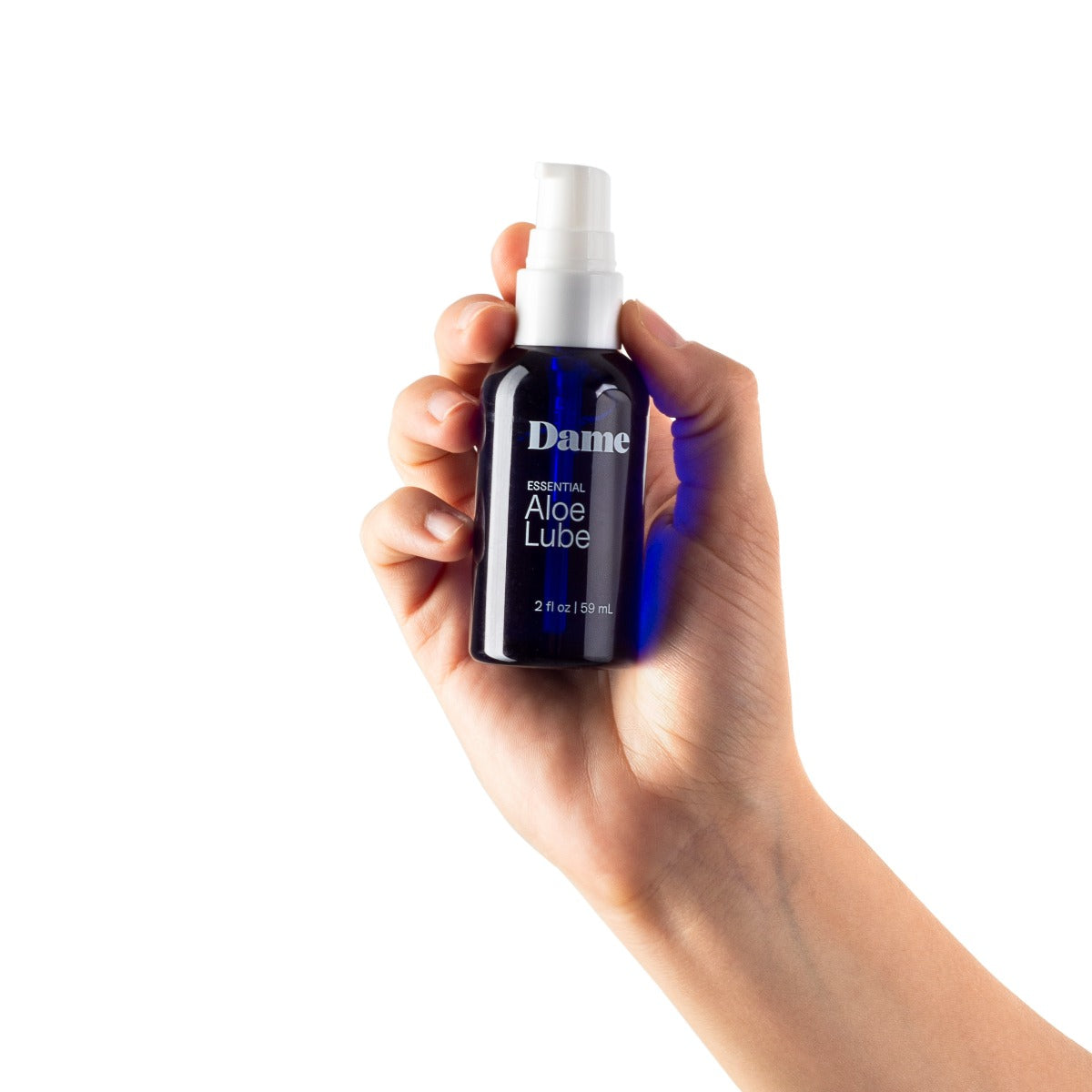 Dame Aloe Lube 2oz bottle held in hand, clear lubricant with aloe for soothing and moisturizing personal use.