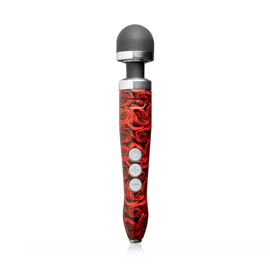 Doxy Die Cast 3 Rechargeable vibrator with rose gold finish standing upright, showcasing its sleek design and textured surface.