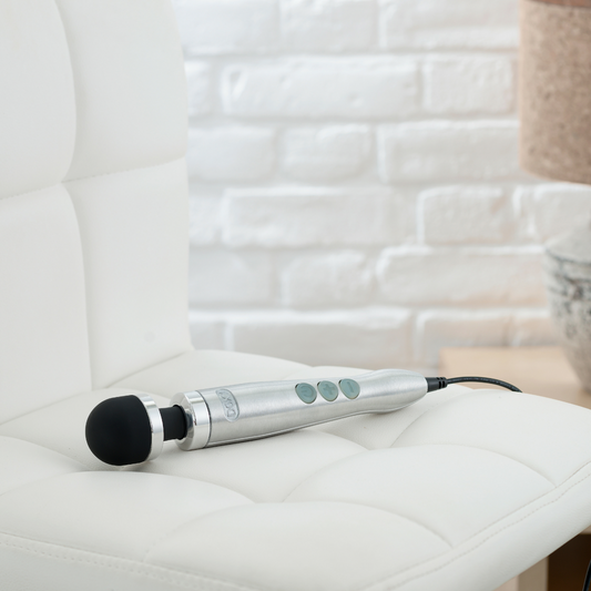 Doxy Die Cast 3 satin brushed metal vibrator with ergonomic design and textured surface for enhanced pleasure.