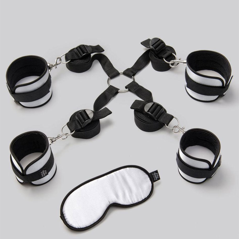 Fifty Shades of Grey Hard Limits bed restraint kit with adjustable straps and cuffs for romantic bondage play.