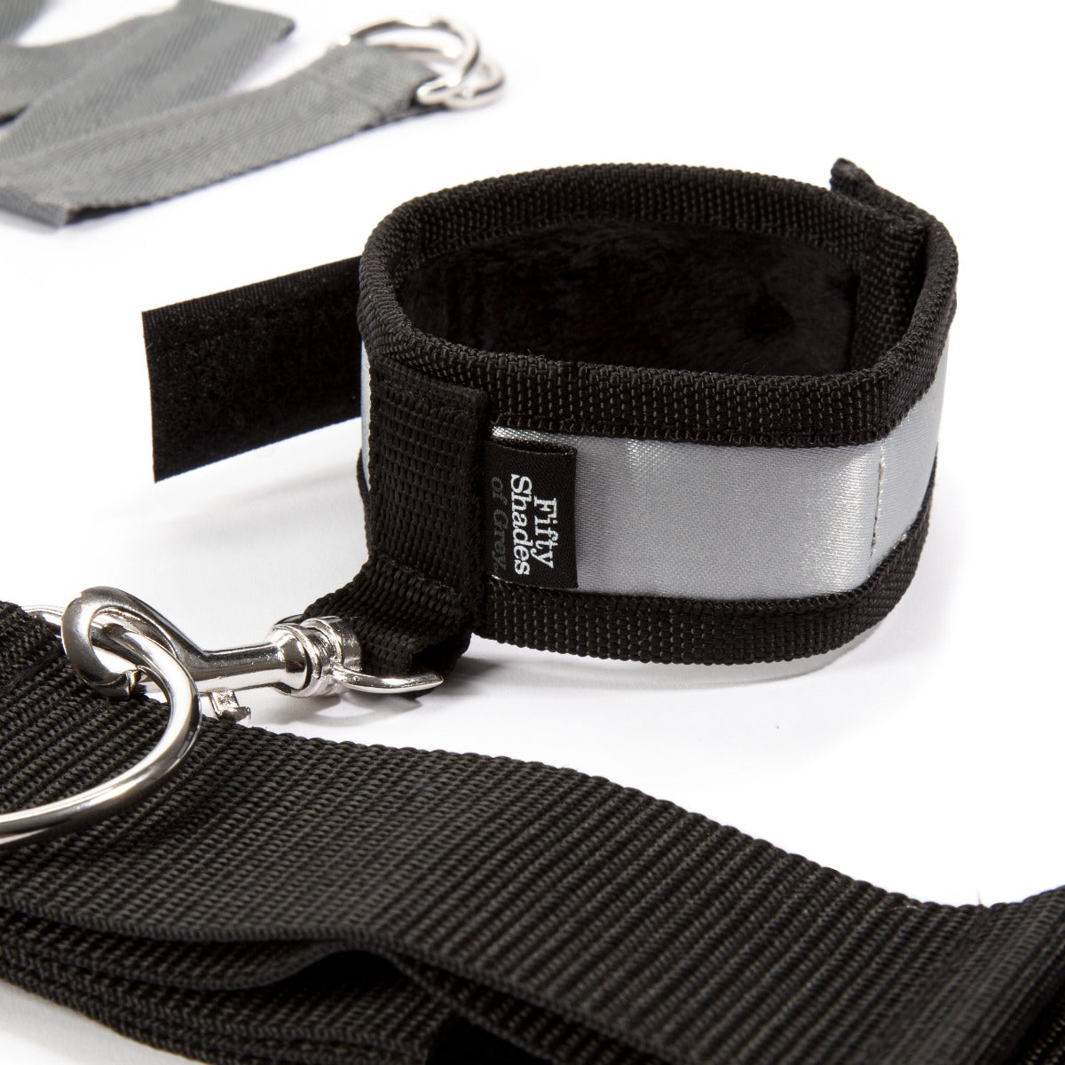 Silver Fifty Shades of Grey Keep Still Over-the-Bed Cross Restraint for bedroom bondage and restraint play.