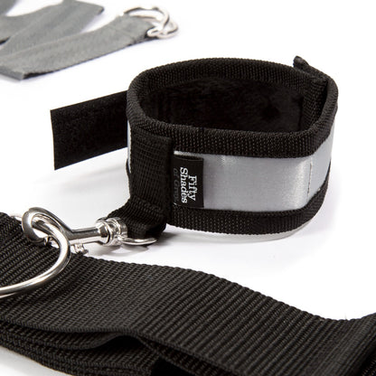 Silver Fifty Shades of Grey Keep Still Over-the-Bed Cross Restraint for bedroom bondage and restraint play.