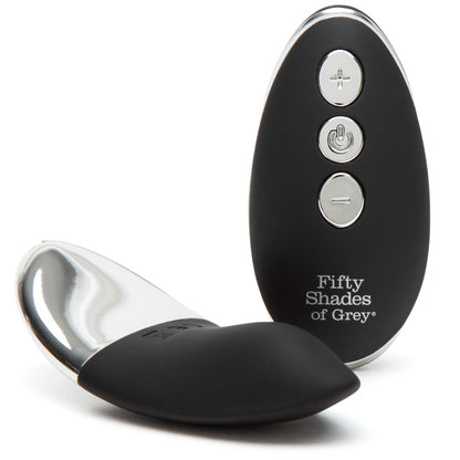 Fifty Shades of Grey Relentless Vibrations remote control panty vibe in black, shown with the vibrating device attached to a lace panty.