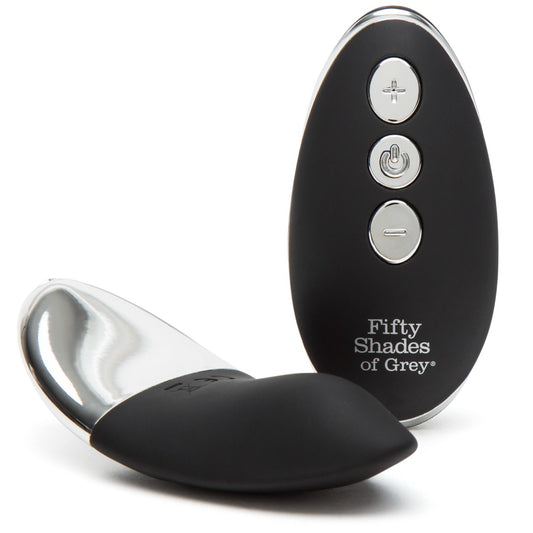 Fifty Shades of Grey Relentless Vibrations remote control panty vibe in black, shown with the vibrating device attached to a lace panty.