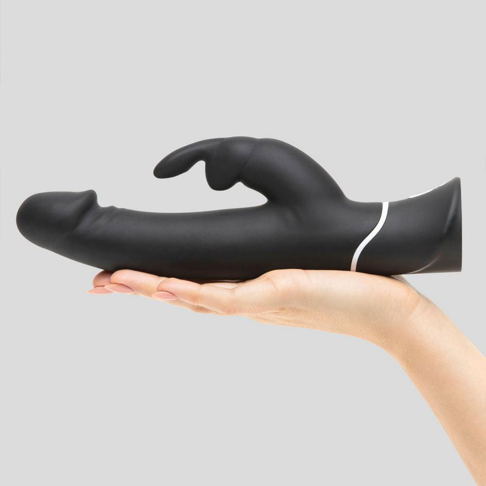 Realistic black rabbit vibrator by Happy Rabbit, rechargeable with detailed textured surface and dual stimulating ears.